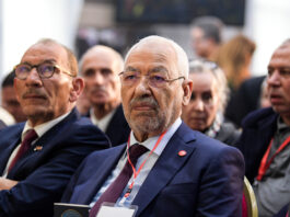 Islamist Ennahdha Party leader Rached Ghannouchi (C) attends the Truth and Dignity Commission (TDC) closing conference in the capital Tunis on December 14, 2018. - The Truth and Dignity Institute, set up in 2014 following the 2011 revolution with a mandate to "reveal the truth about the human rights violations" between 1955 and 2013, is to submit its recommendations to Tunisia's leadership on December 14-15 at a public event before the full report is submitted by December 31. (Photo by FETHI BELAID / AFP) (Photo credit should read FETHI BELAID/AFP via