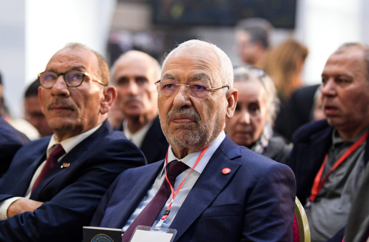 Islamist Ennahdha Party leader Rached Ghannouchi (C) attends the Truth and Dignity Commission (TDC) closing conference in the capital Tunis on December 14, 2018. - The Truth and Dignity Institute, set up in 2014 following the 2011 revolution with a mandate to "reveal the truth about the human rights violations" between 1955 and 2013, is to submit its recommendations to Tunisia's leadership on December 14-15 at a public event before the full report is submitted by December 31. (Photo by FETHI BELAID / AFP) (Photo credit should read FETHI BELAID/AFP via