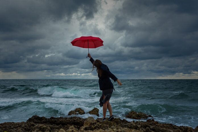 young-woman-with-a-red-umbrella-on-the-background-2025-03-08-12-02-59-utc